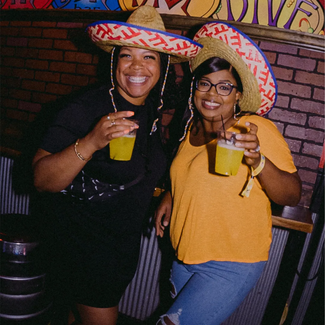 friends share a drink for at the tacos and tequila bar crawl